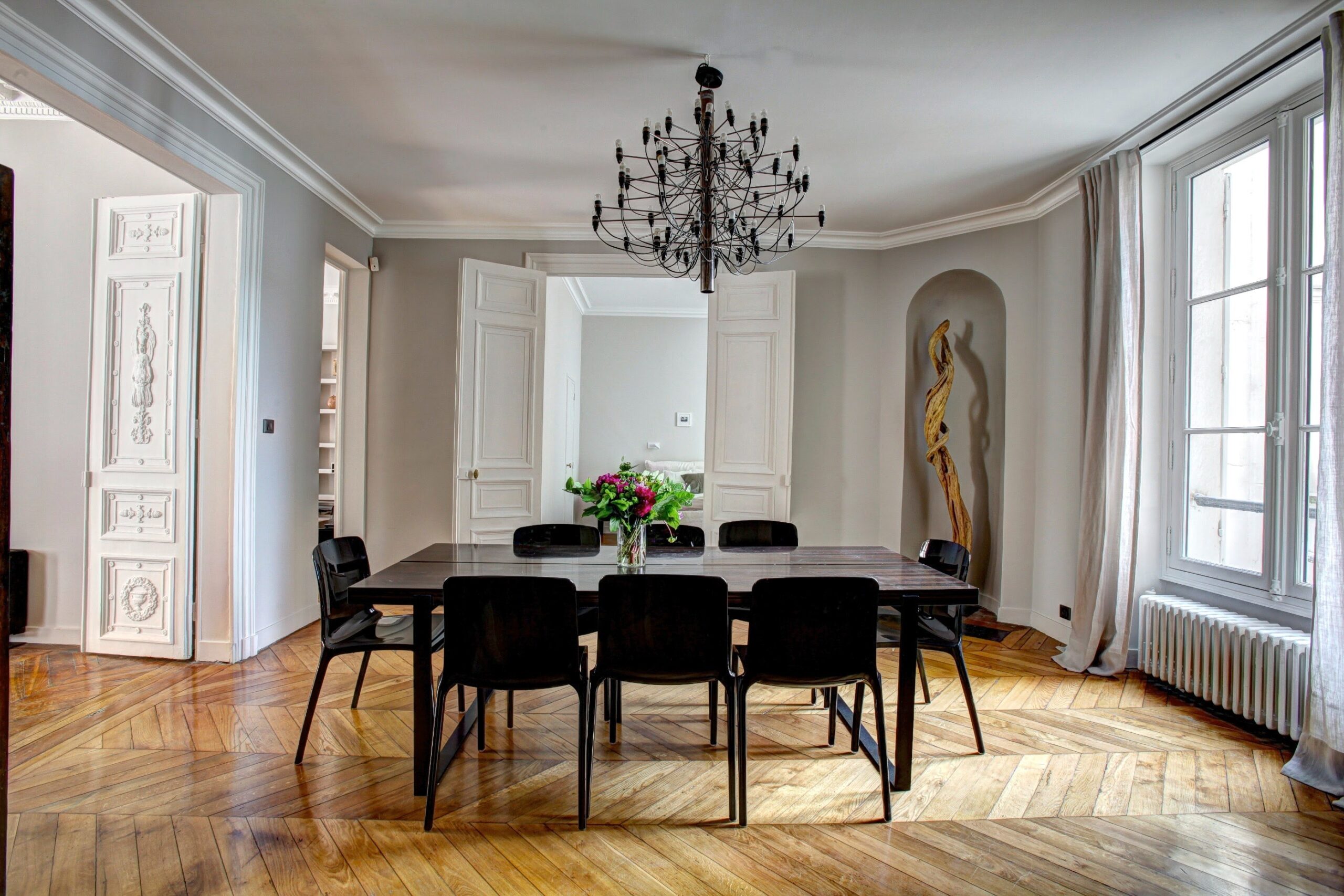Spacious modern dining room with hardwood flooring